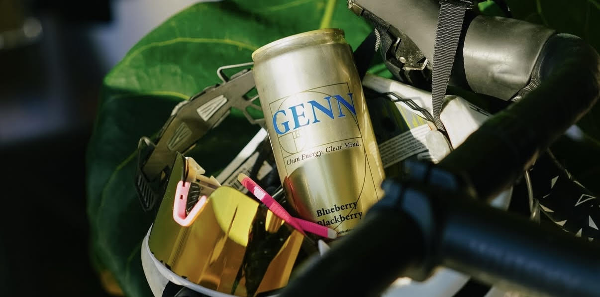 GENN Energy can placed in a bike helmet with glasses and leaves in the background, representing functional hydration, cognitive focus, and brain-first energy.