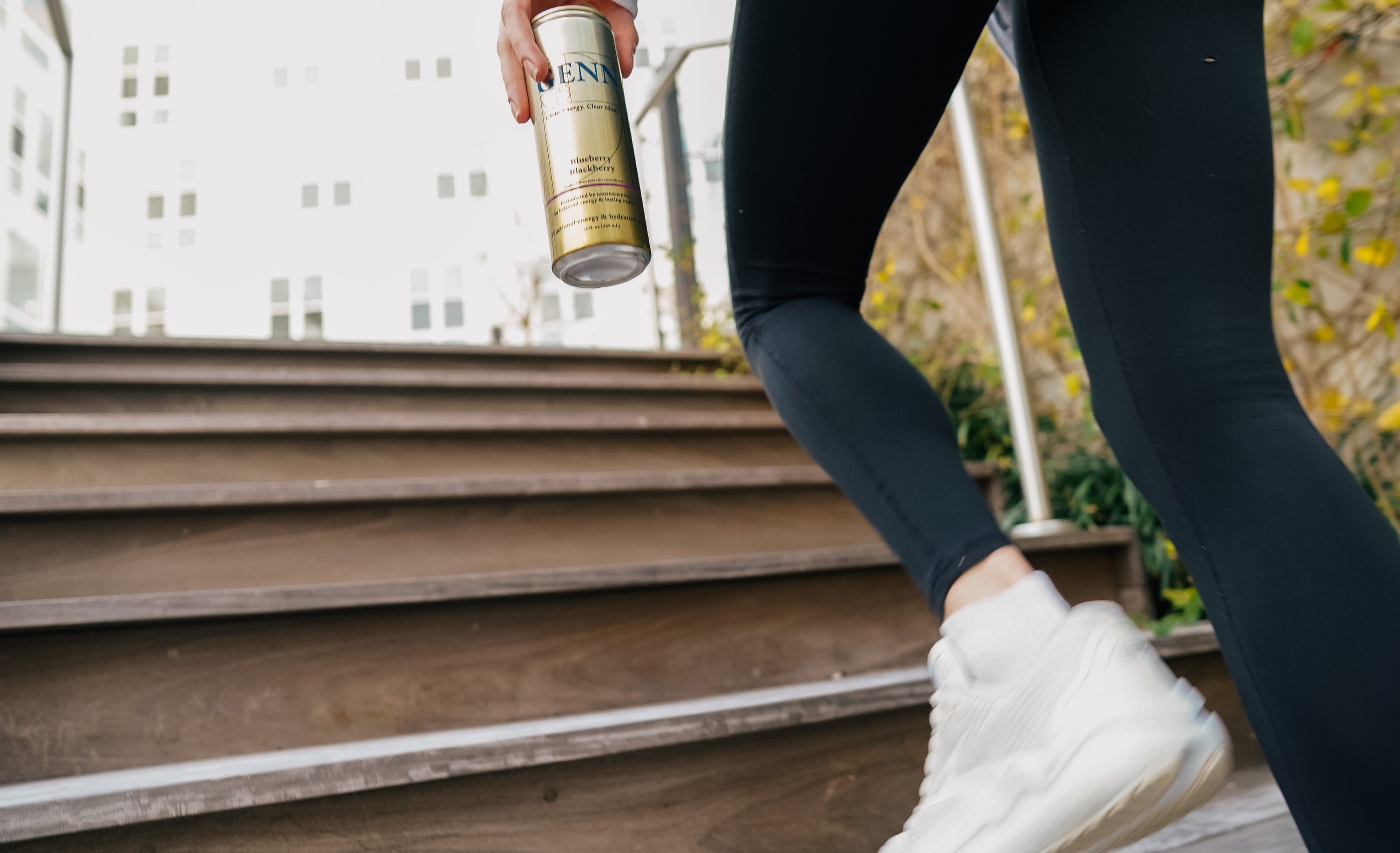 GENN can, active, walking up stairs holding GENN can